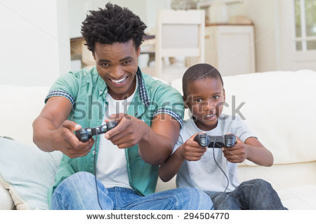 stock-photo-father-and-son-playing-video-games-together-at-home-in-the-living-room-294504770